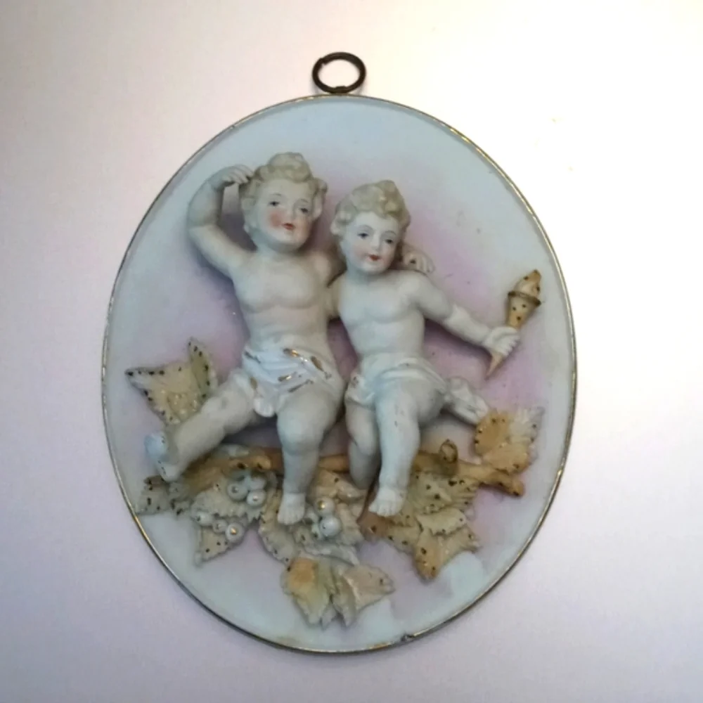 Antique cherub wall plaque